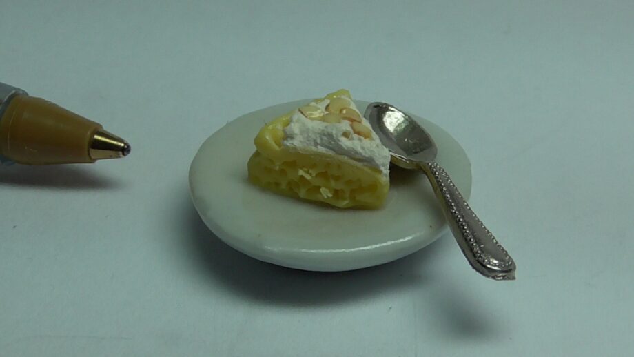 Slice of Lemon Meringue Pie on Plate with Fork