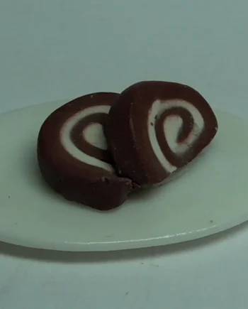 Slices of Swiss roll on a china plate