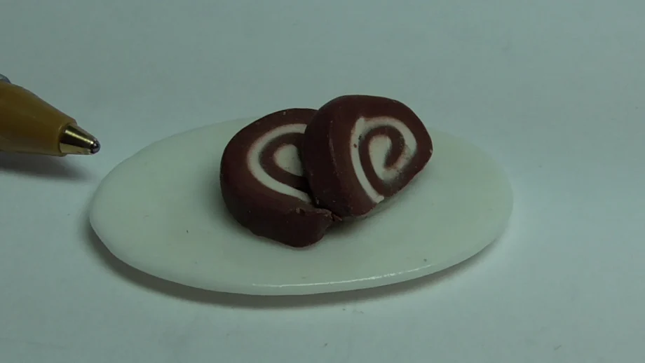 Slices of Swiss roll on a china plate